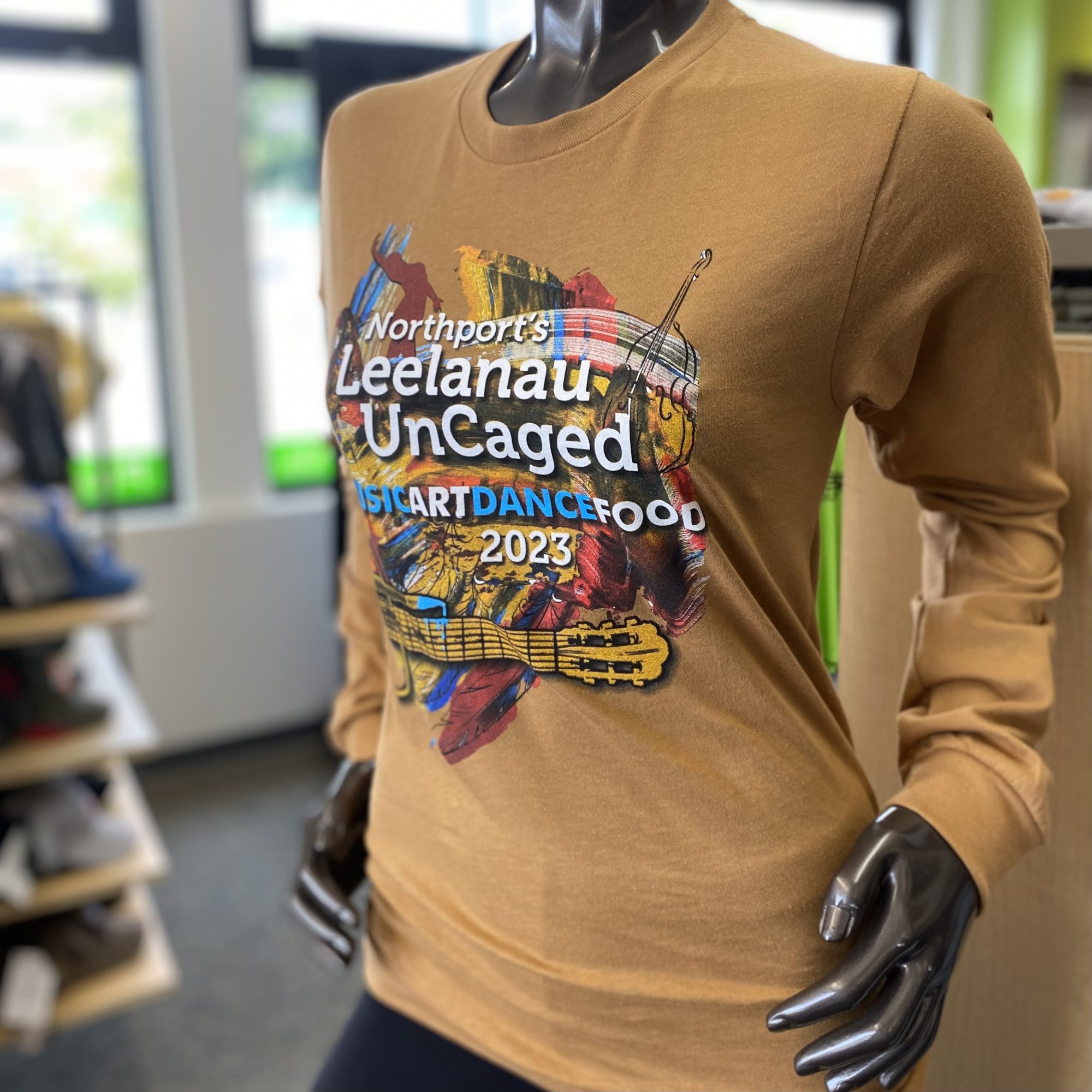 Screenprinted t-shirt with Leelanau Uncaged's 2023 design on the front.